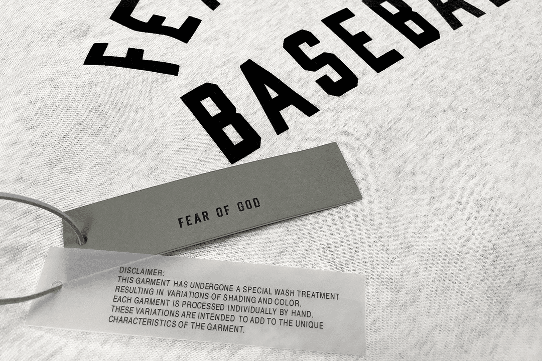 Fear of god bracelet with text tag.