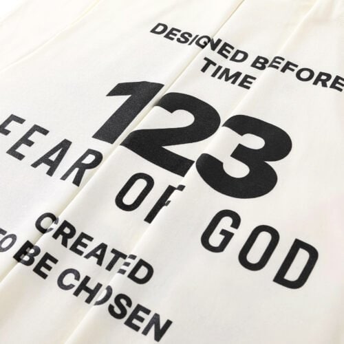 Designed Before Time, 123 Year of God Motivational Quote T-Shirt for K-pop fans, showcasing stylish text and bold numbers, perfect for merchandise collectors and fans of Korean pop culture.