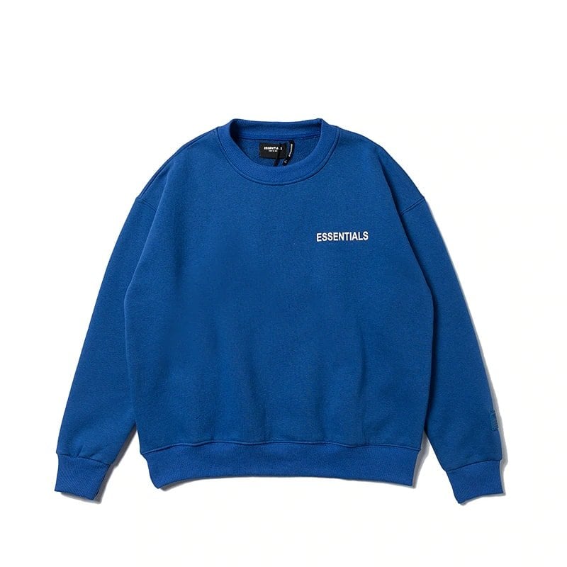 Blue oversized sweatshirt with "ESSENTIALS" text, K-pop merch, stylish casual wear, unisex fashion, comfortable streetstyle.