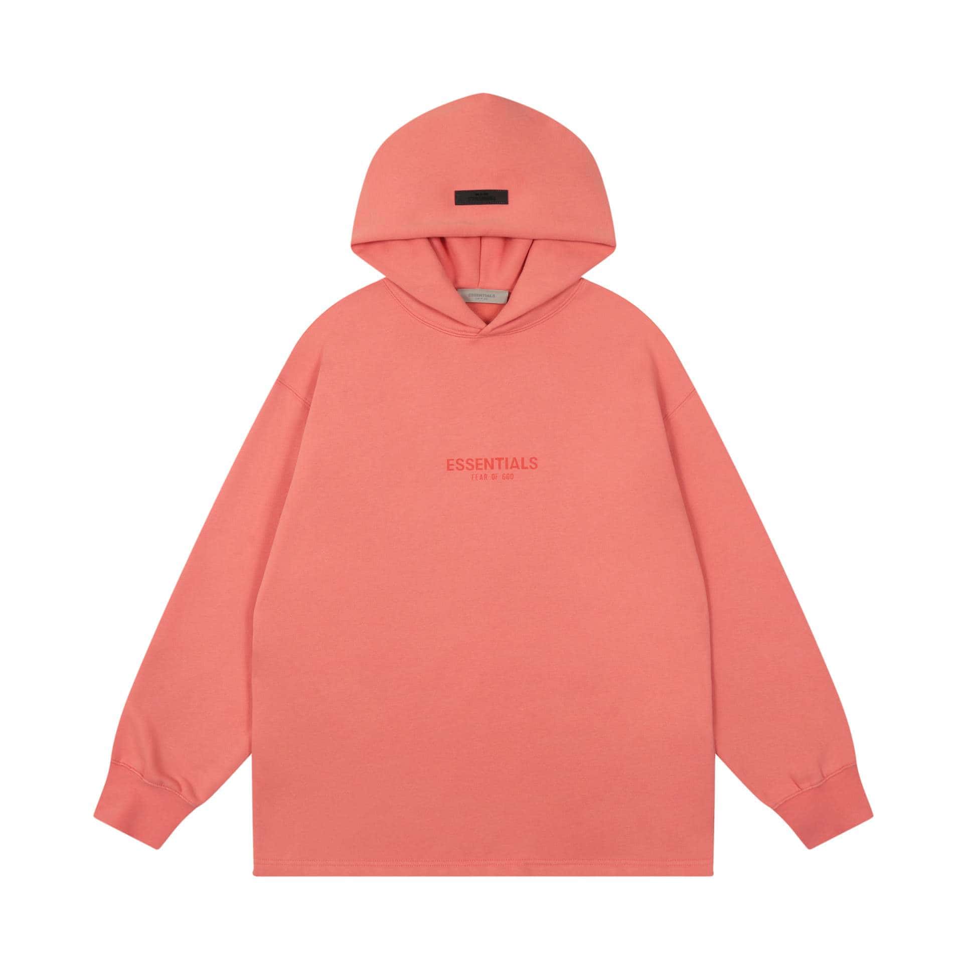 Soft pink oversized hoodie with "ESSENTIALS" branding on the front, perfect for casual K-pop merch collection. Features a cozy hood and comfortable fit, ideal for everyday wear and showing fandom pride.