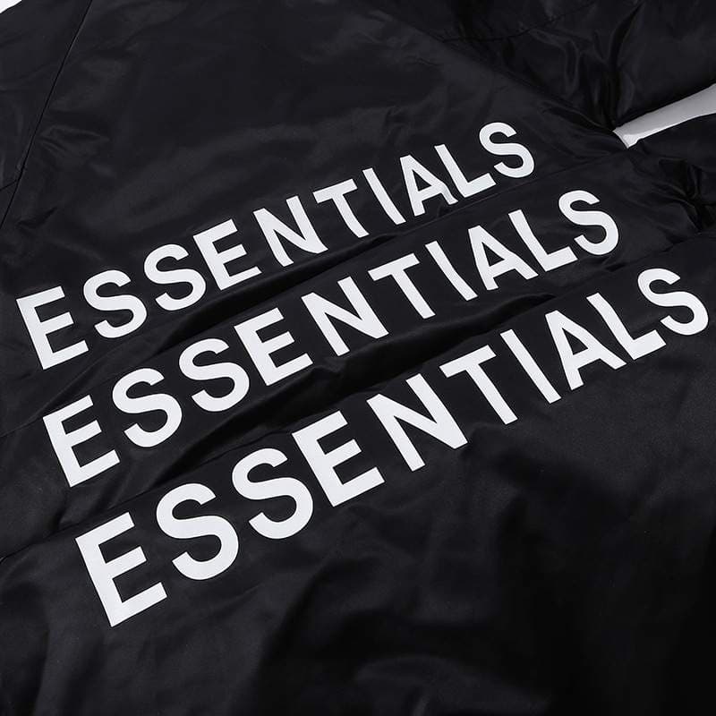 ESSENTIALS black hoodie with white text for K-pop merchandise, popular among fans for its stylish and minimalist design. A must-have item for K-pop enthusiasts and collectors of K-pop merch.