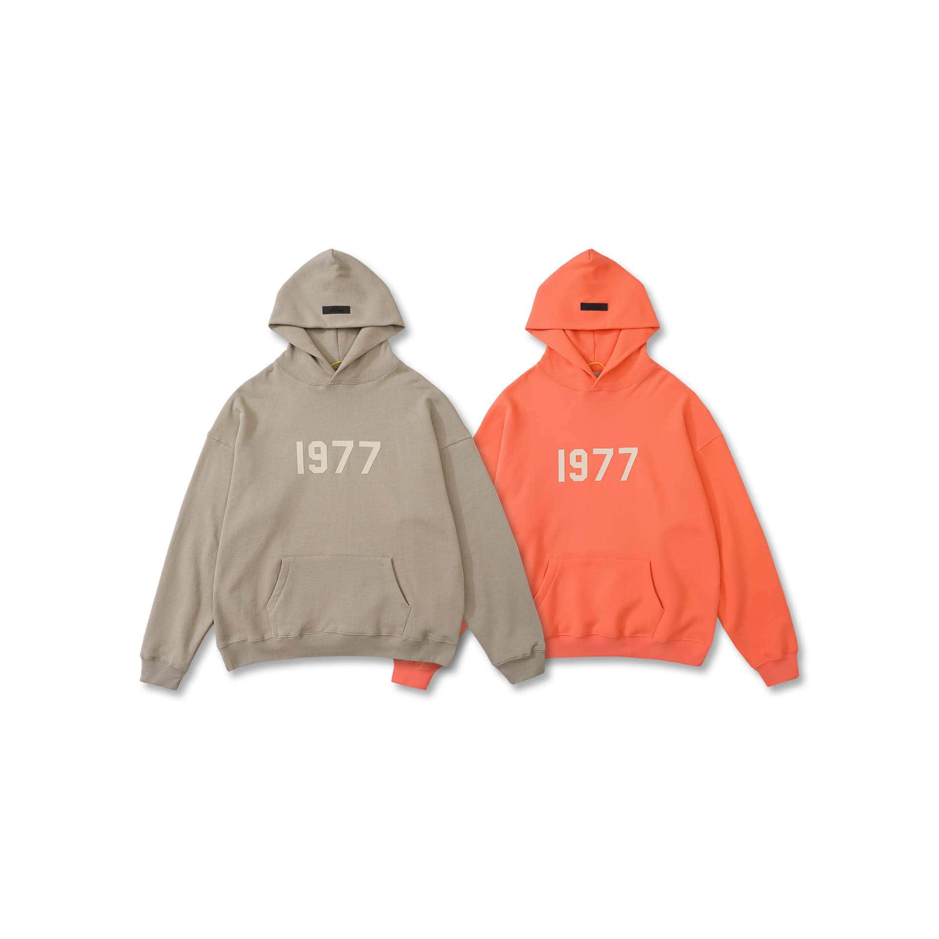 2. Two stylish hoodies with "1977" printed on the front, one in beige and the other in bright orange, perfect for K-pop fans.