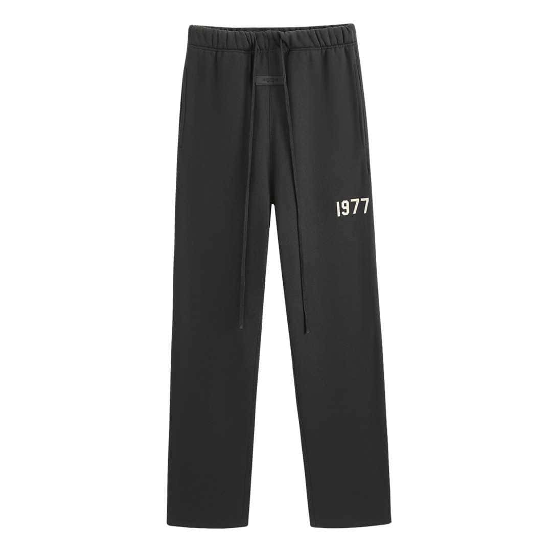 1977 black sweatpants with side stripes and drawstring waist, perfect for casual wear or concert trips.
