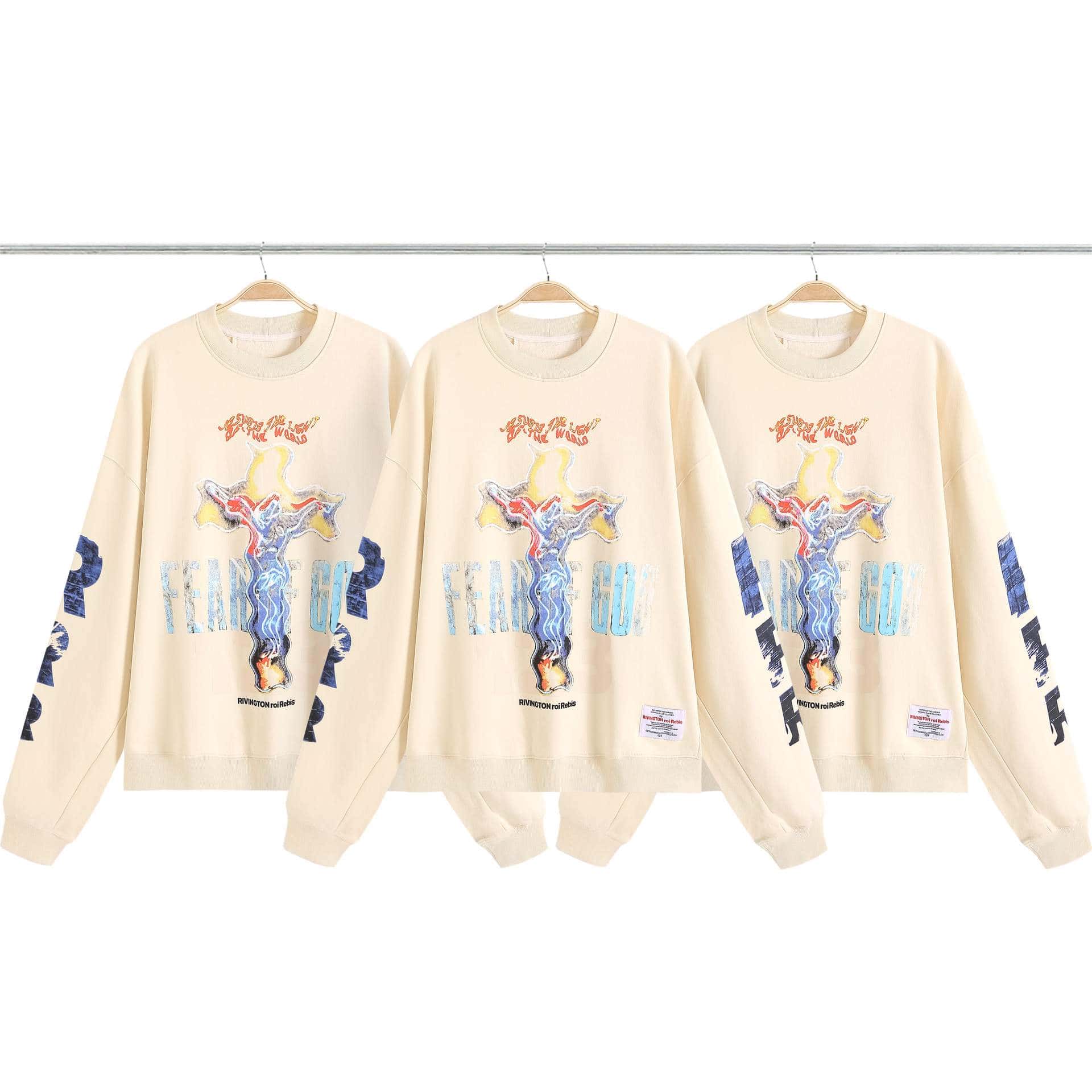 Fear of God x Rivington crewneck sweatshirt with colorful graphic design featuring flames and surreal artwork, perfect for K-pop merchandise fans.