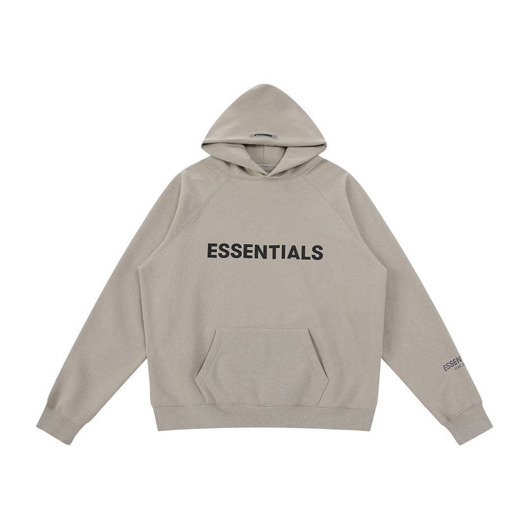Gray hoodie with "ESSENTIALS" printed on the front, casual streetwear style, minimal design, soft cotton fabric, oversized fit, long sleeves, front pocket, trendy K-pop inspired merchandise.