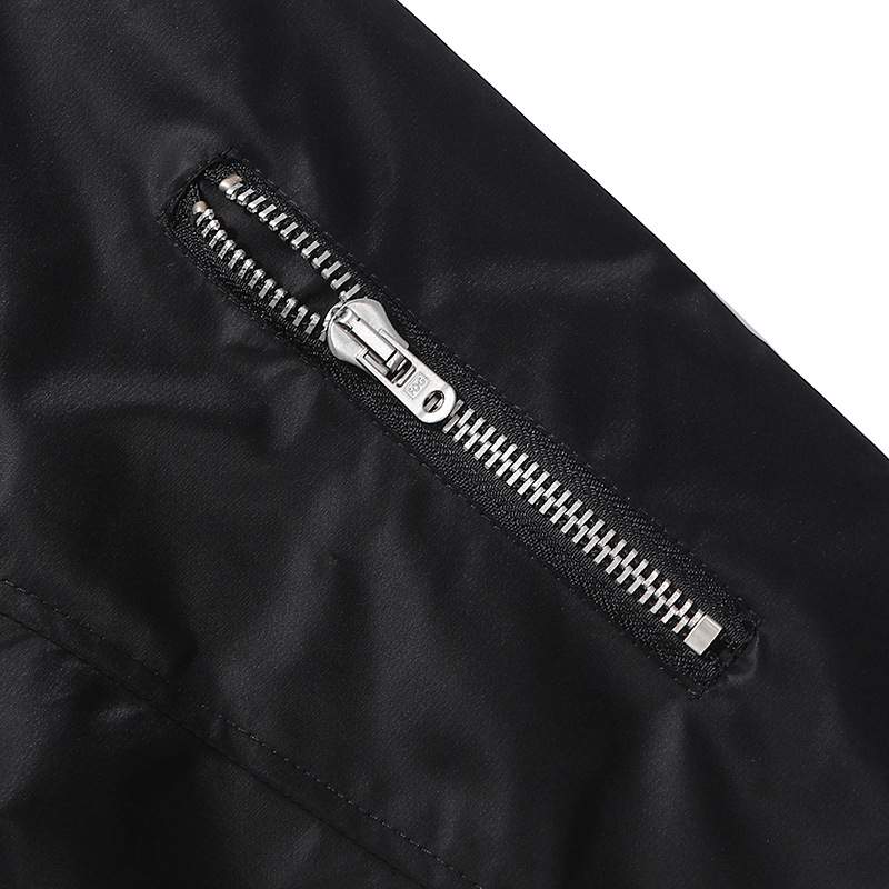 Zipper on black fabric, part of K-pop merchandise.