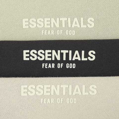 ESSENTIALS FEAR OF GOD black and white logo graphic with repeated text design, often popular in K-pop fandom merchandise collections.