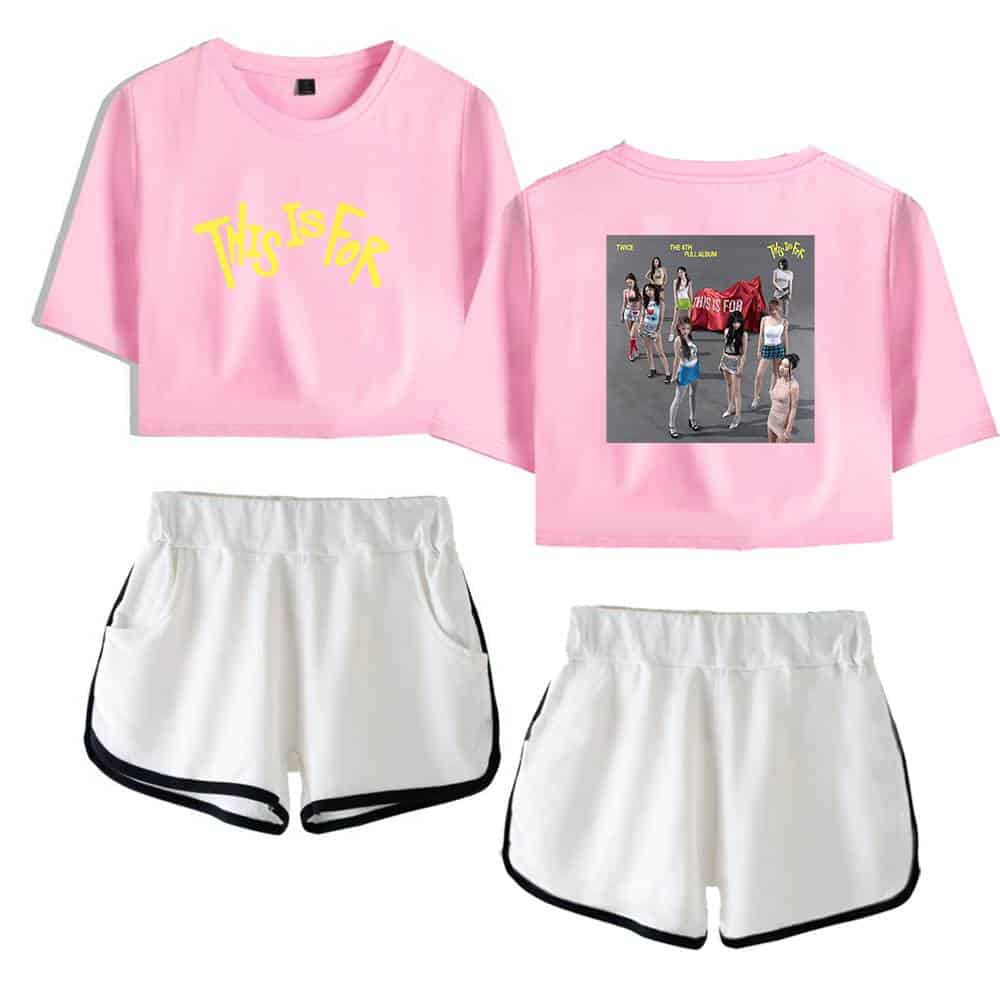 Pink K-pop merch set featuring a cropped T-shirt with “This Is For” text and a graphic of a girl group, paired with white athletic shorts with black trim, perfect for K-pop fans.