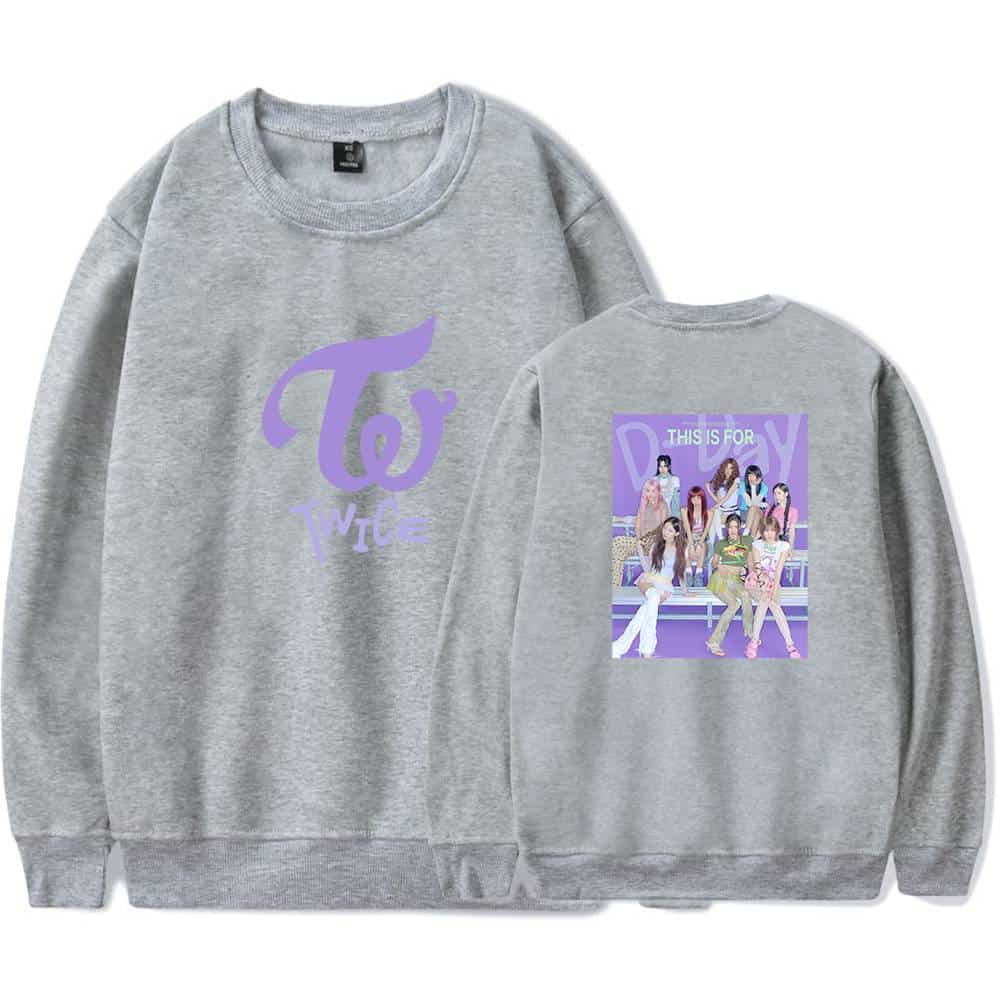 TWICE K-pop merchandise sweatshirt with group logo on front and photo of TWICE members on back.
