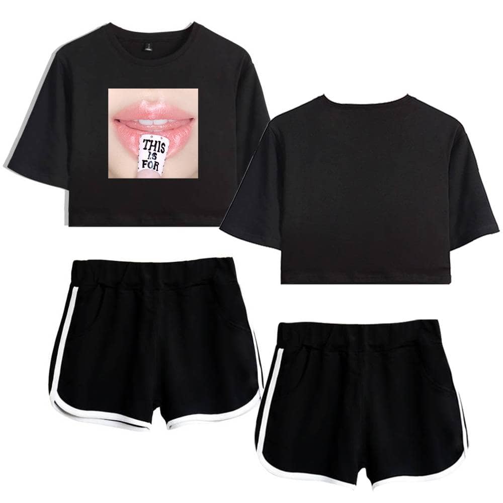 - black t-shirt with a close-up of lips and a sticker that says "THIS IS FOR" on the tongue, paired with black shorts with white piping.